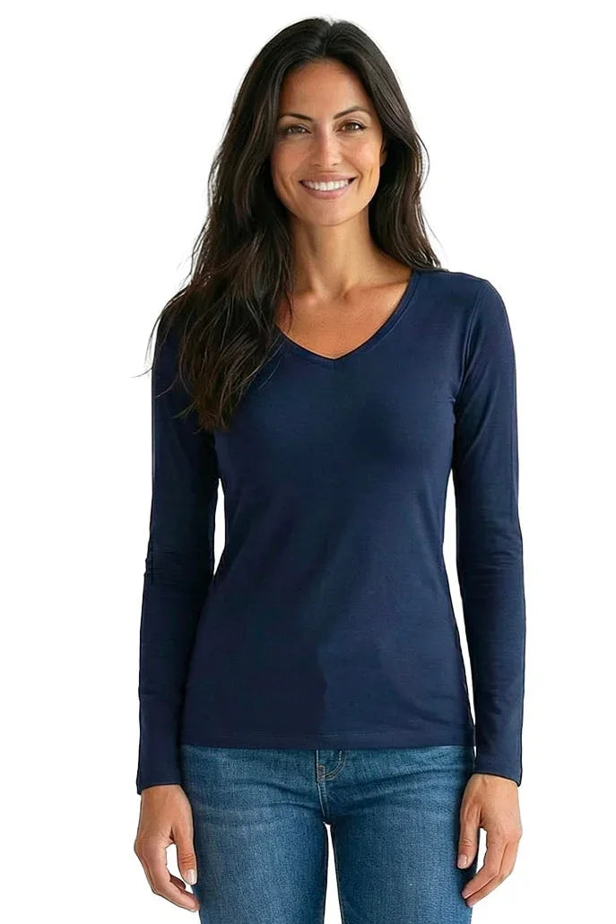 Woman wearing a navy blue V-neck long sleeve lounge tee with jeans