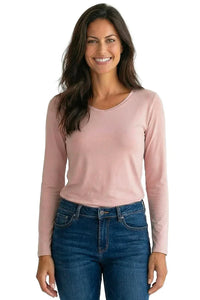 Woman wearing a shell pink long sleeve Pima cotton tee with blue jeans