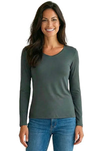 Woman wearing dark green long sleeve Pima cotton loungewear top and blue jeans