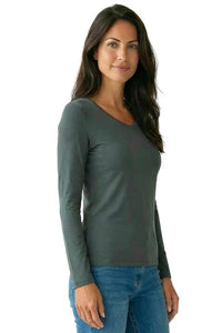 Woman wearing a long sleeve dark green Pima cotton loungewear tee with blue jeans