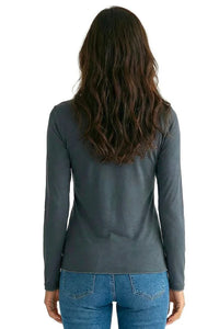 Woman wearing long sleeve steel blue loungewear tee and jeans, back view