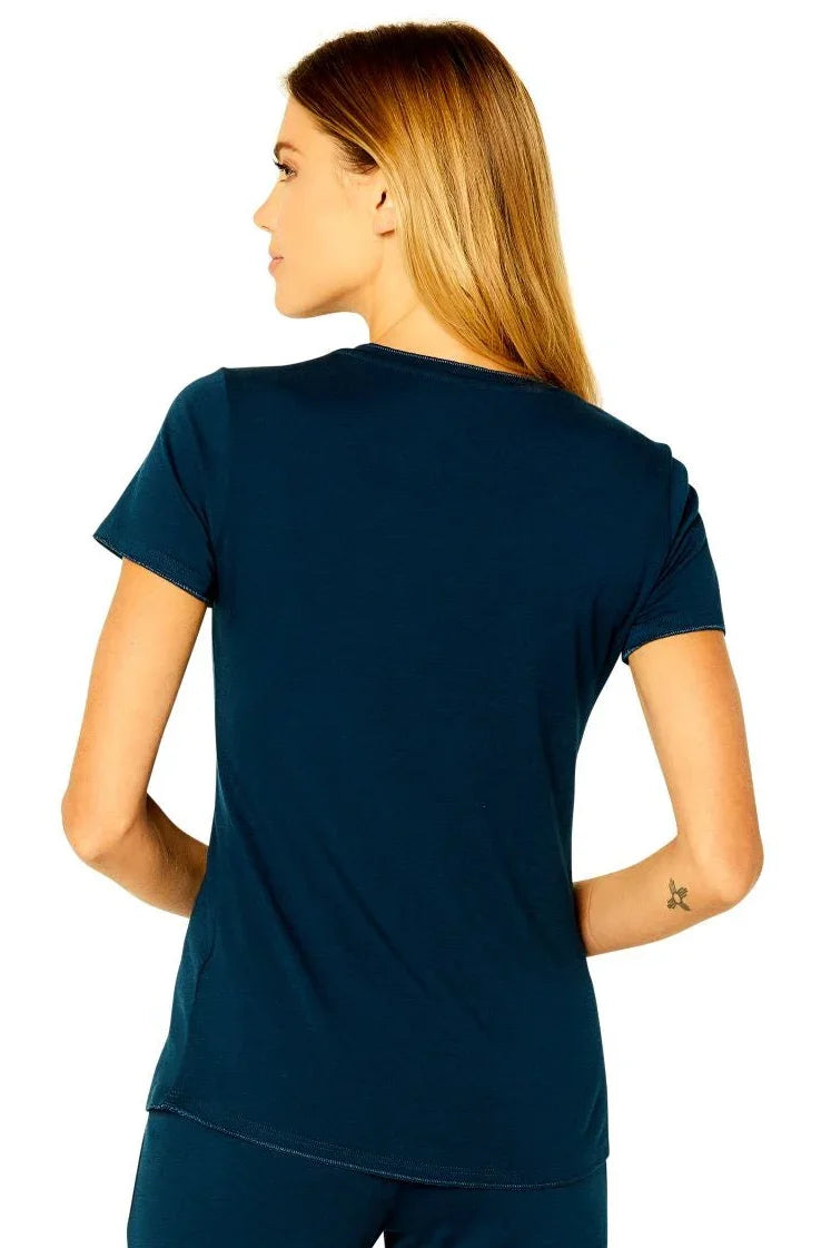 Woman wearing short sleeve insignia blue Pima cotton loungewear tee, back view