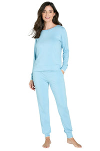 Woman wearing light blue long sleeve Pima cotton loungewear set, relaxed fit