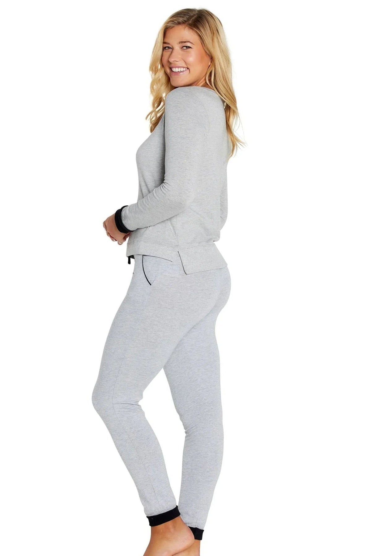 Woman wearing heather gray Pima cotton loungewear set with long sleeves and jogger pants
