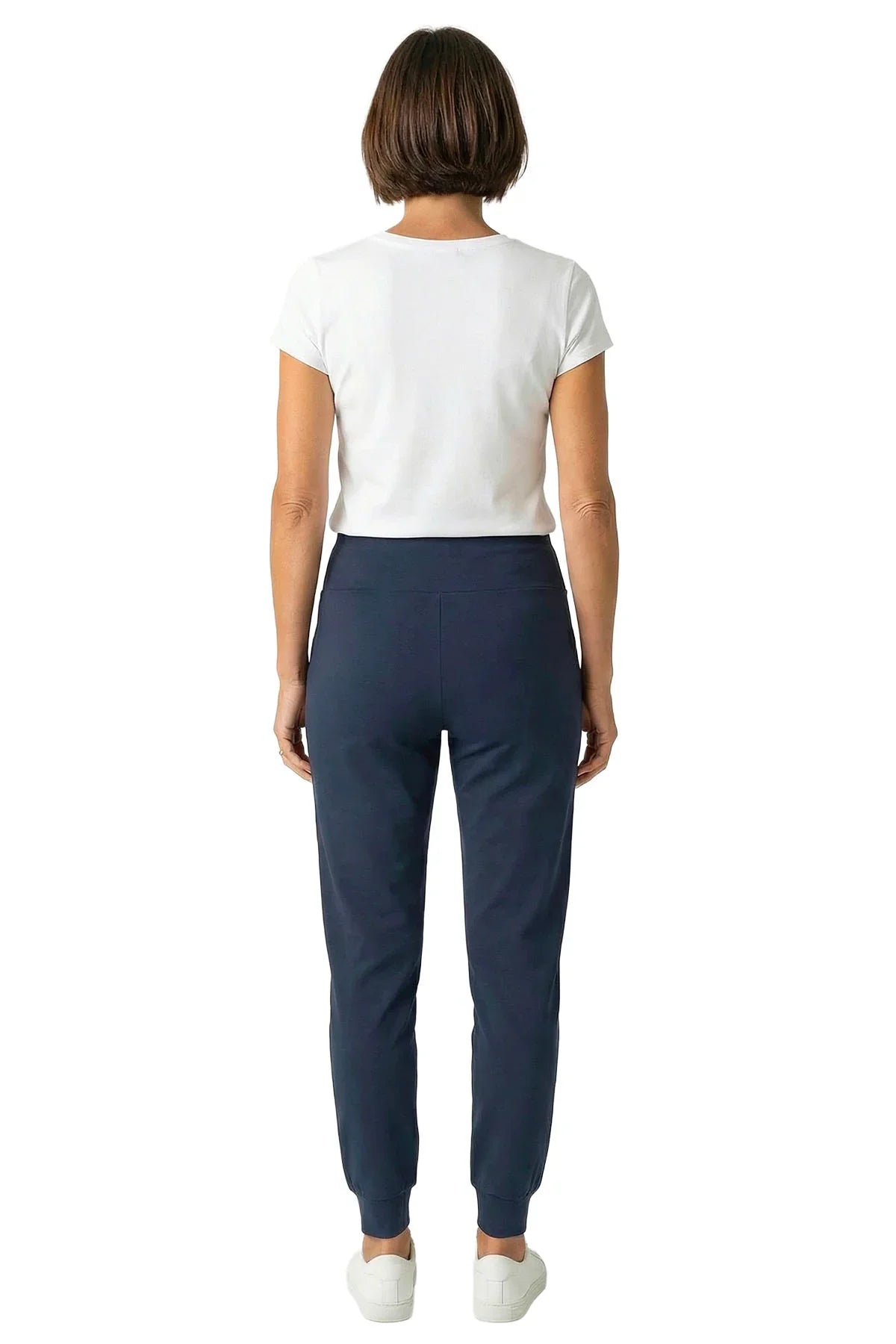Woman in white short-sleeve tee and steel blue lounge joggers, back view, on white background