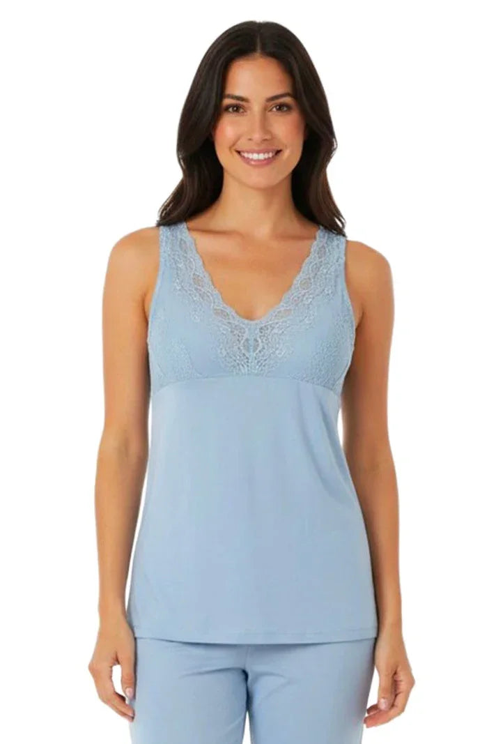 Woman wearing light blue sleeveless lace trim loungewear top and matching pants