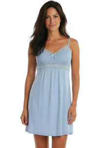 Woman wearing light blue lace-trimmed sleeveless nightgown, soft loungewear sleepwear