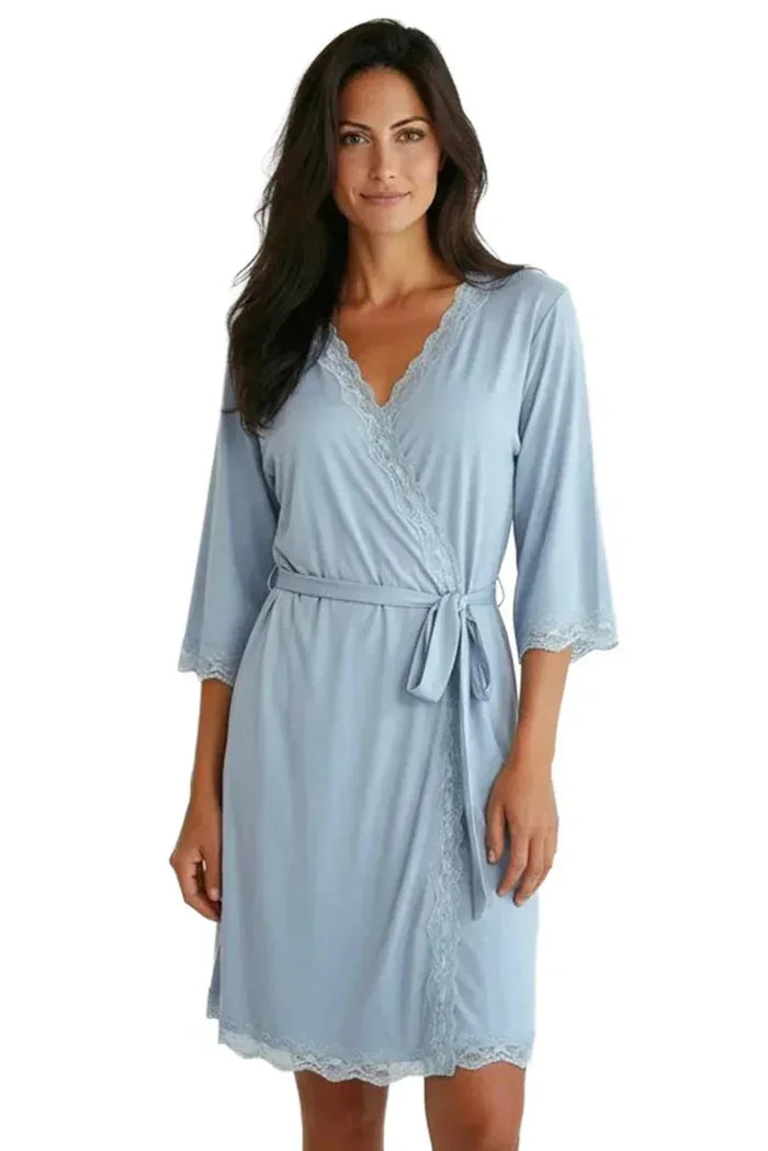 Woman wearing light blue lace-trimmed robe with tie belt, soft loungewear sleepwear