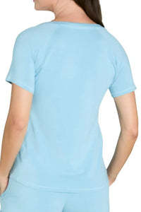 Back view of woman wearing sky blue short sleeve Pima cotton loungewear top and bottoms