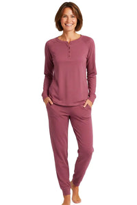Woman wearing rosewood long sleeve Pima cotton loungewear set with jogger pants