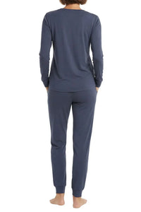 Back view of woman in steel blue long sleeve loungewear pajama set on white background
