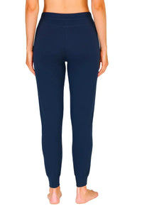 Back view of a woman wearing midnight blue Pima cotton loungewear jogger pants