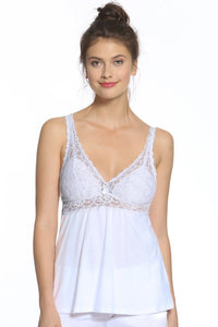 Woman wearing white lace trim Pima cotton sleepwear top, relaxed fit, against white background