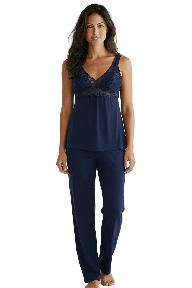 Woman wearing indigo Pima cotton lace trim sleepwear set with camisole and pants