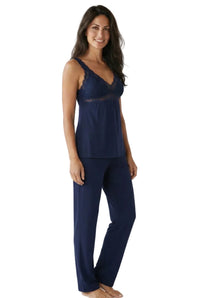 Woman wearing indigo lace-trim Pima cotton loungewear camisole and pants set