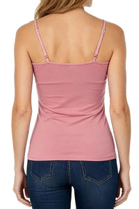 Back view of woman wearing silky rose pink camisole top with adjustable straps and dark blue jeans