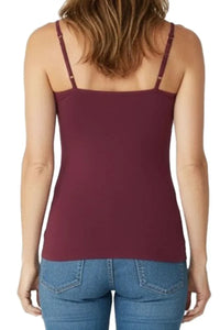 Back view of woman wearing Bordeaux burgundy cami tank top and blue jeans