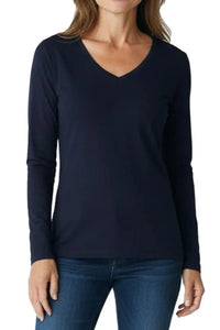 Woman wearing a midnight blue long-sleeve V-neck shirt paired with blue jeans
