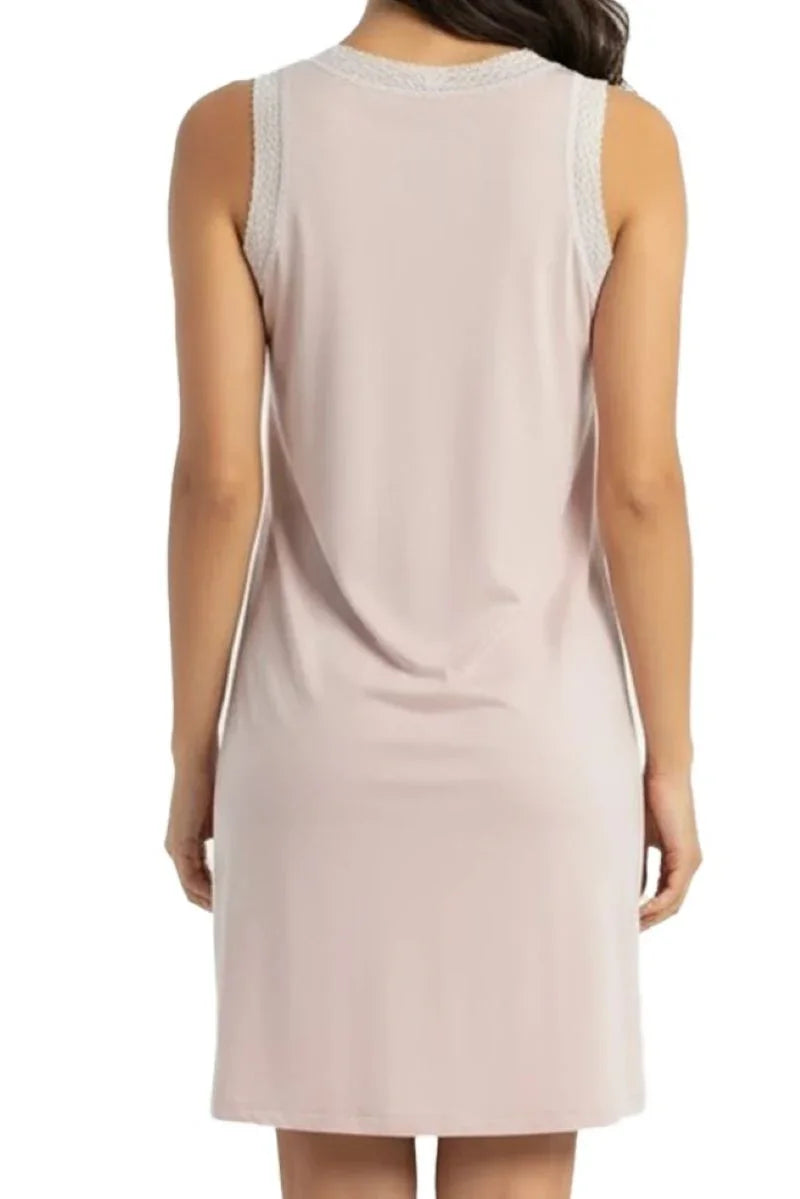 Back view of woman wearing sleeveless shell pink casual dress with lace trim on shoulders