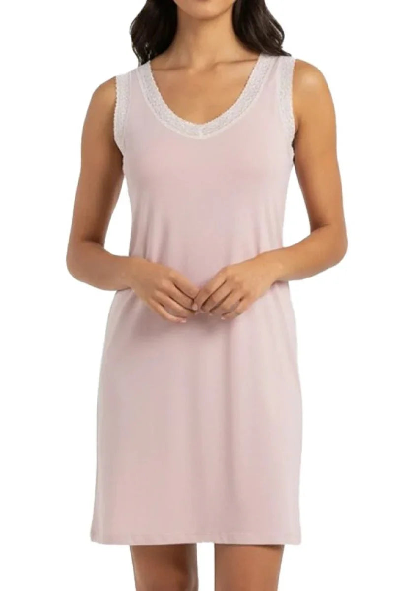 Sleeveless shell pink nightdress with lace trim on neckline and armholes worn by woman