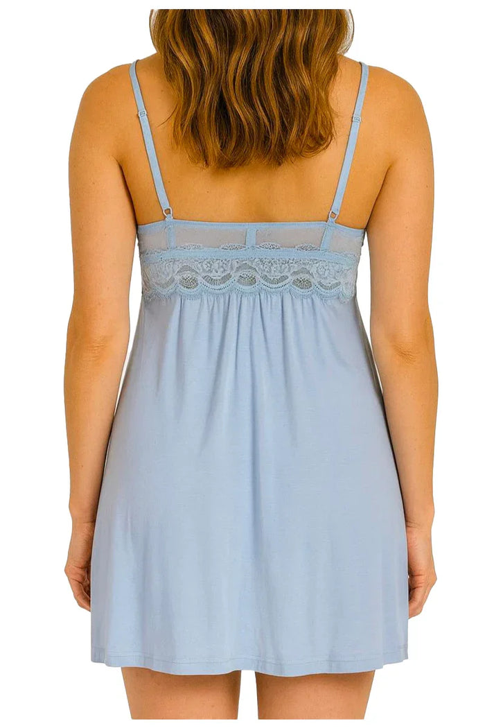 Back view of woman wearing light blue lace-trimmed sleeveless nightdress with adjustable straps