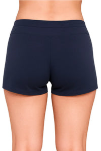 Back view of a person wearing midnight blue fitted shorts with a low-rise waistband