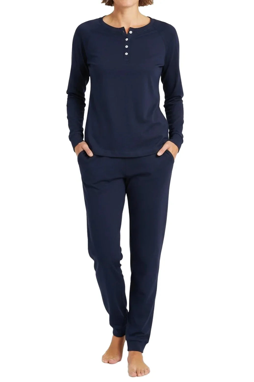 Woman wearing midnight blue long-sleeve Henley top and matching jogger pants loungewear set