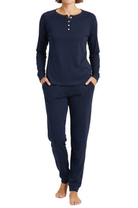 Woman wearing midnight blue long-sleeve Henley top and matching jogger pants loungewear set