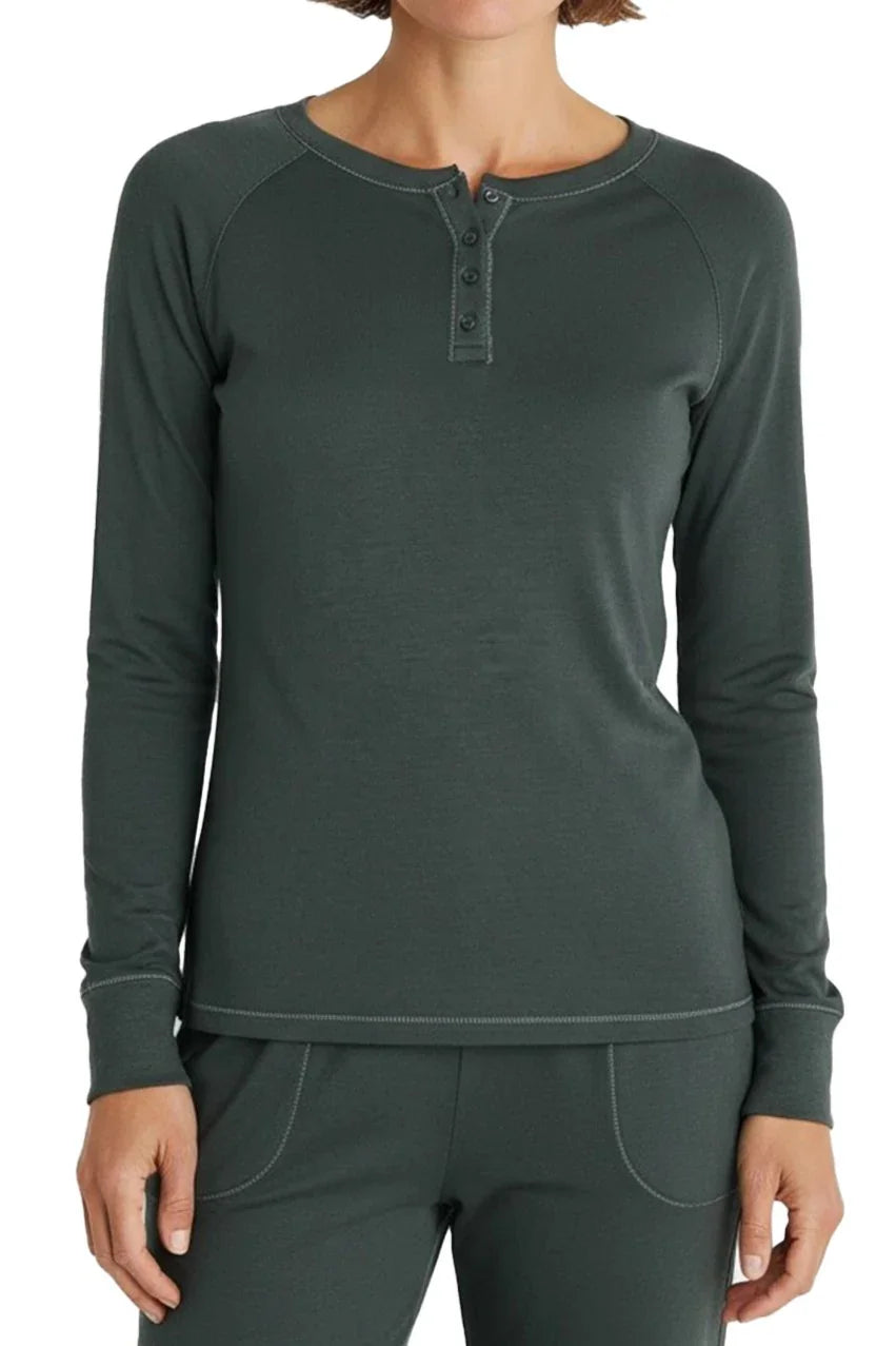 Woman wearing spruce green long-sleeve henley shirt and matching pants with button details