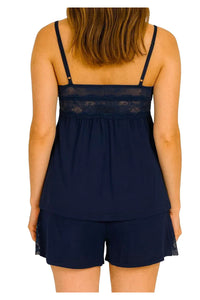 Back view of woman wearing navy blue lace trim camisole and shorts pajama set