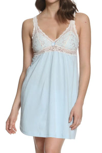Woman wearing light blue lace-trimmed sleeveless nightdress with floral details
