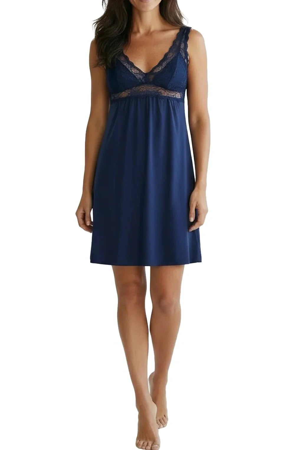 Woman wearing indigo blue lace-trimmed sleeveless nightdress on white background